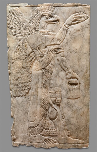 panneau en relief de figure surnaturelle à tête d